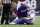 Buffalo Bills quarterback Josh Allen (17) is check on after he was injured during the second half of an NFL football game against the Houston Texans, Sunday, Oct. 14, 2018, in Houston. (AP Photo/Michael Wyke)