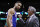 FILE - In this Wednesday, May 9, 2018 file photo,Philadelphia 76ers coach Brett Brown, right, talks with guard Ben Simmons before Game 5 of the team's NBA basketball playoff series against the Boston Celtics in Boston. Philadelphia 76ers coach Brett Brown is expecting more out of guards Ben Simmons and Markelle Fultz this season. The guards failed to hit a 3-pointer last season. Brown says the duo will have to be better from long range this season. (AP Photo/Charles Krupa, File)