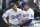 Los Angeles Dodgers' Enrique Hernandez, left, confers with assistant coach Chris Woodward before a baseball game against the Oakland Athletics, Tuesday, April 10, 2018, in Los Angeles. (AP Photo/Michael Owen Baker)