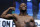 Floyd Mayweather Jr. poses on the scale during a weigh-in Friday, Aug. 25, 2017, in Las Vegas. Mayweather is scheduled to fight Conor McGregor in a boxing bout Saturday. (AP Photo/John Locher)