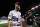 Washington Nationals Bryce Harper (34) leaves the field after the Nationals ended their last home game of the season with a 9-3 rain delayed win against the Miami Marlins in Washington, Wednesday, Sept. 26, 2018. (AP Photo/Manuel Balce Ceneta)
