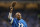 DETROIT, MI - DECEMBER 16:  Former Detroit Lions player Wallace 'Wally' Triplett waves to the fans during the game against the Baltimore Ravens at Ford Field on December 16, 2013 in Detroit, Michigan. Wally Triplett was only the third African-American chosen in the1949 NFL Draft and was the first of the draftees to take the field in a league game. The Ravens defeated the Lions 18-16.  (Photo by Leon Halip/Getty Images)