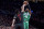 Boston Celtics guard Kyrie Irving, right, shoots over Portland Trail Blazers guard Evan Turner during the second half of an NBA basketball game in Portland, Ore., Sunday, Nov. 11, 2018. The Trail Blazers won 100-94. (AP Photo/Craig Mitchelldyer)