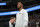 Injured Minnesota Timberwolves guard Jimmy Butler watches during the first half of the team's NBA basketball game against the Denver Nuggets on Thursday, April 5, 2018, in Denver. (AP Photo/David Zalubowski)