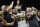 New Orleans Saints running back Mark Ingram (22) celebrates his touchdown with fans after jumping into the stands in the first half of an NFL football game against the Philadelphia Eagles in New Orleans, Sunday, Nov. 18, 2018. (AP Photo/Bill Feig)