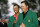 Phil Mickelson, right, gets his Masters Green Jacket from last years champion Tiger Woods after winning the 2006 Masters golf tournament at the Augusta National Golf Club in Augusta, Ga., Sunday, April 9, 2006. (AP Photo/Mory Gash)