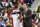 Washington Wizards head coach Scott Brooks speaks with guard John Wall (2) during the second half of an NBA basketball game against the New York Knicks, Sunday, Nov. 4, 2018, in Washington. (AP Photo/Al Drago)