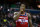 Washington Wizards center Dwight Howard looks at the scoreboard during the first half of the team's NBA basketball game against the Portland Trail Blazers on Sunday, Nov. 18, 2018, in Washington. (AP Photo/Al Drago)