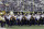 Members Washington Huskies band stand on the field during a moment of silence in tribute to Microsoft founder and philanthropist Paul Allen, who died Monday, Oct. 15, 2018, before an NCAA college football game between Washington and Colorado, Saturday, Oct. 20, 2018, in Seattle. (AP Photo/Ted S. Warren)