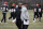FILE - In this Nov. 14, 2018, file photo, Cincinnati Bengals special assistant Hue Jackson, left, speaks with head coach Marvin Lewis during NFL football practice at Paul Brown Stadium in Cincinnati. Marvin Lewis shut down the question emphatically. The Bengals head coach won’t be talking about the newest addition to his staff, one who’s in an unusual position to influence the next game. Hue Jackson was the Cleveland Browns head coach less than a month ago. Now he’s on the Bengals sideline with Lewis, trying to beat them _ a sensitive subject that the head coach is tried to put off limits on Wednesday. (AP Photo/John Minchillo, File)
