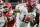 Alabama's Tua Tagovailoa scrambles from Georgia's Trenton Thompson during the second half of the NCAA college football playoff championship game Monday, Jan. 8, 2018, in Atlanta. (AP Photo/David J. Phillip)