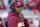 FILE- In this Nov. 3, 2018, file photo Florida State head coach Willie Taggart confers on his headset during the first half of an NCAA college football game against North Carolina State in Raleigh, N.C. The Seminoles have a chance to salvage their season against No. 13 Florida (8-3, No. 11 CFP) in Tallahassee on Saturday, Nov. 24. (AP Photo/Chris Seward, File)