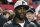 Former Atlanta Falcons quarterback Michael Vick stands on the sidelines before the first half of an NFL football game between the Atlanta Falcons and the New Orleans Saints, Sunday, Jan. 1, 2017, in Atlanta. (AP Photo/John Bazemore)