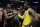 Miami Heat guard Dwyane Wade, left, shakes hands with Los Angeles Lakers' LeBron James at the end of an NBA basketball game Monday, Dec. 10, 2018, in Los Angeles. (AP Photo/Marcio Jose Sanchez)