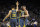 OAKLAND, CA - DECEMBER 12:  Jonas Jerebko #21, Draymond Green #23, and Stephen Curry #30 of the Golden State Warriors congratulate one another after the Warriors made a basket against the Toronto Raptors at ORACLE Arena on December 12, 2018 in Oakland, California.  NOTE TO USER: User expressly acknowledges and agrees that, by downloading and or using this photograph, User is consenting to the terms and conditions of the Getty Images License Agreement.  (Photo by Ezra Shaw/Getty Images)