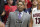 Arizona's assistant coach Book Richardson, left, and Nick Johnson (13) stand and watch the game from the bench as Arizona plays New Mexico State in the second half of an NCAA college basketball game on Wednesday, Dec. 11, 2013 in Tucson, Ariz. (AP Photo/John MIller)