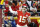 Kansas City Chiefs quarterback Patrick Mahomes (15) throws a touchdown pass to wide receiver Demarcus Robinson, unseen, during the second half of an NFL football game against the Oakland Raiders in Kansas City, Mo., Sunday, Dec. 30, 2018. With the throw, Patrick Mahomes joins Peyton Manning & Tom Brady as the only players with 50+ pass touchdowns in a single season in NFL history. (AP Photo/Charlie Riedel)