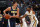 Denver Nuggets center Nikola Jokic (15) and New Orleans Pelicans forward Anthony Davis (23) in the first half of an NBA basketball game Friday, Nov. 17, 2017, in Denver. (AP Photo/David Zalubowski)