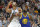 Utah Jazz center Rudy Gobert, left, and Golden State Warriors forward Draymond Green (23) battle for position under the basket in the second half during an NBA basketball game Friday, Oct. 19, 2018, in Salt Lake City. (AP Photo/Rick Bowmer)