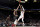Miami Heat guard Dwyane Wade, right, hits a shot over Portland Trail Blazers guard CJ McCollum, center, as forward Al-Farouq Aminu watches during the first half of an NBA basketball game in Portland, Ore., Tuesday, Feb. 5, 2019. (AP Photo/Steve Dykes)