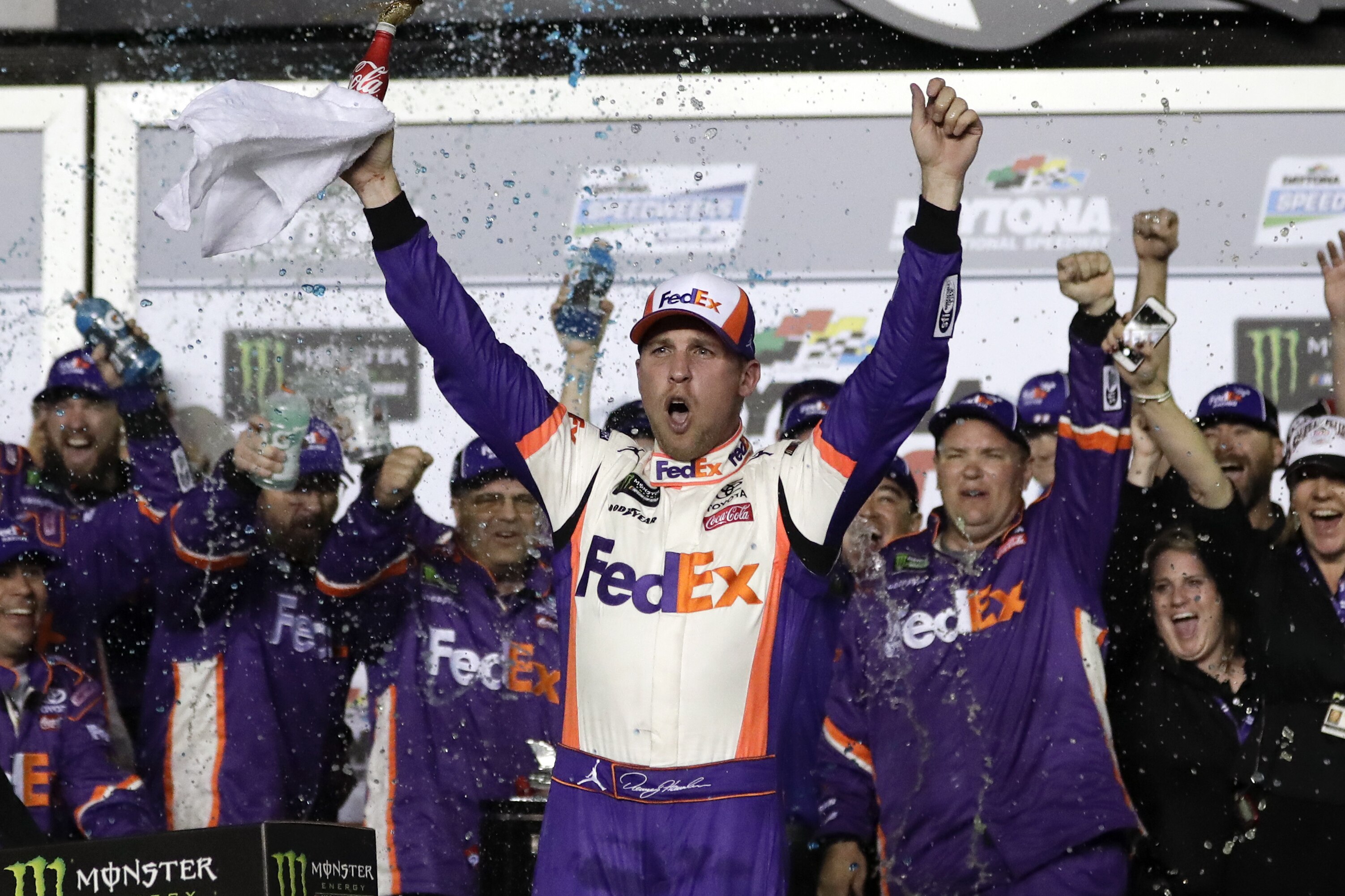 Denny Hamlin celebrates in Victory Lane after winning the NASCAR Daytona 500 auto race at Daytona International Speedway, Sunday, Feb. 17, 2019, in Daytona Beach, Fla. (AP Photo/John Raoux)