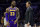 Los Angeles Lakers' head coach Luke Walton, right, talks things over with LeBron James, left, during the first half of an NBA basketball game against the Philadelphia 76ers, Sunday, Feb. 10, 2019, in Philadelphia. The 76ers won 143-120. (AP Photo/Chris Szagola)