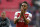 Arsenal's Gabonese striker Pierre-Emerick Aubameyang reacts on the pitch after the English Premier League football match between Tottenham Hotspur and Arsenal at Wembley Stadium in London, on March 2, 2019. - The game finished 1-1. (Photo by Ian KINGTON / AFP) / RESTRICTED TO EDITORIAL USE. No use with unauthorized audio, video, data, fixture lists, club/league logos or 'live' services. Online in-match use limited to 120 images. An additional 40 images may be used in extra time. No video emulation. Social media in-match use limited to 120 images. An additional 40 images may be used in extra time. No use in betting publications, games or single club/league/player publications. /         (Photo credit should read IAN KINGTON/AFP/Getty Images)
