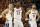 Virginia guard Kyle Guy (5) Virginia guard De'Andre Hunter (12) and Virginia guard Ty Jerome (11) watch a foul shot during the second half of an NCAA college basketball game in Charlottesville, Va., Tuesday, Jan. 22, 2019. Virginia defeated Wake Forest 68-45. (AP Photo/Steve Helber)