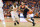 SYRACUSE, NY - MARCH 04:  Ty Jerome #11 of the Virginia Cavaliers drives to the basket against Frank Howard #23 of the Syracuse Orange during the first half at the Carrier Dome on March 4, 2019 in Syracuse, New York. Virginia defeats Syracuse 79-53.  (Photo by Brett Carlsen/Getty Images)