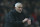 Manchester United's coach Jose Mourinho sets the extra time during the English Premier League soccer match between Manchester United and Arsenal at Old Trafford stadium in Manchester, England, Wednesday Dec. 5, 2018. (AP Photo/Dave Thompson)