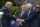 President Donald Trump shakes hands with New England Patriots owner Robert Kraft, accompanied by head coach Bill Belichick, center, during a ceremony on the South Lawn of the White House in Washington, Wednesday, April 19, 2017, where the president honored the Super Bowl Champion New England Patriots for their Super Bowl LI victory.. (AP Photo/Susan Walsh)