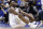 Duke's Zion Williamson sits on the floor following a injury during the first half of an NCAA college basketball game against North Carolina in Durham, N.C., Wednesday, Feb. 20, 2019. (AP Photo/Gerry Broome)