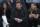 FILE - In this Oct. 20, 2018, file photo, Madison Square Garden chairman James Dolan, center, watches an NBA basketball game between the New York Knicks and the Boston Celtics at Madison Square Garden in New York. It's been a year since Dolan announced his intent to sell the New York Liberty, and the team is still on the market. There have been several potential buyers and a few have gotten close to purchasing the team, but for various reasons all the potential deals fell through. Even without a new owner on the horizon and the Liberty in the same situation as last November, there is no danger of the team ceasing to exist this winter. (AP Photo/Mary Altaffer, File)