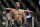 FILE - In this Saturday, Dec. 3, 2016 file photo, Demetrious Johnson reacts after defeating Tim Elliott during a mixed martial arts flyweight bout in Las Vegas. Demetrious Johnson chasing an unprecedented 11th title defense and a headline fight that could decide Conor McGregor’s next opponent top a UFC 216 card set for Saturday, Oct. 7, 2017 in Las Vegas, an event playing out in a city still reeling from a mass shooting in which 58 people were killed and nearly 500 were injured. (AP Photo/John Locher, File)