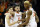 Virginia guard Kyle Guy (5), Ty Jerome (11) and forward Mamadi Diakite (25) watch a foul shot during the second half of an NCAA college basketball game against Louisville in Charlottesville, Va., Saturday, March 9, 2019. (AP Photo/Steve Helber)