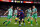 TOPSHOT - Barcelona's Argentinian forward Lionel Messi (C) vies with Real Betis' Spanish defender Marc Bartra (L) during the Spanish league football match between FC Barcelona and Real Betis at the Camp Nou stadium in Barcelona on November 11, 2018. (Photo by Josep LAGO / AFP)        (Photo credit should read JOSEP LAGO/AFP/Getty Images)