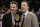 Minnesota coach Richard Pitino, right, stands with his father, Rick Pitino, after Minnesota's 65-63 win over SMU in an NCAA college basketball game in the final of the NIT on Thursday, April 3, 2014, in New York. (AP Photo/Frank Franklin II)