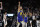 Golden State Warriors guard Stephen Curry (30) celebrates after making a buzzer basket at the end of the first quarter of an NBA basketball game against the San Antonio Spurs, in San Antonio, Monday, March 18, 2019. (AP Photo/Eric Gay)