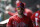 FILE - In this March 11, 2019 file photo Philadelphia Phillies right fielder Bryce Harper walks in the dugout before a spring training baseball game against the Tampa Bay Rays in Clearwater, Fla. Harper came to Philadelphia to do the one thing he didn't accomplish in Washington: Win in October. The Phillies gave him the biggest contract in baseball history to deliver. The 26-year-old slugger was a six-time All-Star, 2012 NL Rookie of the Year and 2015 NL Most Valuable Player during seven seasons with the Nationals. But he couldn't help Washington win a postseason series in four tries. (AP Photo/Chris O'Meara, file)