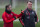 Manchester United's Dutch manager Louis van Gaal (R) talks with Manchester United's English striker Wayne Rooney during a team training session in Manchester, north west England, on November 24, 2015, ahead of their UEFA Champions League Group B football match against PSV Eindhoven on November 25.    AFP PHOTO / OLI SCARFF / AFP / OLI SCARFF        (Photo credit should read OLI SCARFF/AFP/Getty Images)