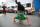 In this Dec. 12, 2018 photo, Venezuelan Karin Rojas balances on her head as she breakdances with Angel Fernandez for tips from commuters in Lima, Peru. Rojas, 25, arrived in Lima in 2016, leaving behind her mountainous home in the Venezuelan state of Merida, where she ran a break dancing collective with her husband. (AP Photo/Cesar Olmos)