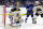 Boston Bruins goaltender Tuukka Rask (40) stops a shot by the Tampa Bay Lightning as Lightning's Brayden Point (21) battles defenseman Connor Clifton (75) for a rebound during the second period of an NHL hockey game Monday, March 25, 2019, in Tampa, Fla. (AP Photo/Chris O'Meara)