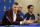Newly acquired player Kristaps Porzingis, left, responds to questions as head coach Rick Carlisle, center, and team owner Mark Cuban, right, listen during a news conferences where the newly acquired players were introduced in Dallas, Monday, Feb. 4, 2019. (AP Photo/Tony Gutierrez)
