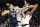 Connecticut guard Katie Lou Samuelson (33) knocks the ball from Louisville forward Sam Fuehring, center, and Louisville forward Bionca Dunham (33)  during the first half of a regional championship final in the NCAA women's college basketball tournament, Sunday, March 31, 2019, in Albany, N.Y. (AP Photo/Kathy Willens)