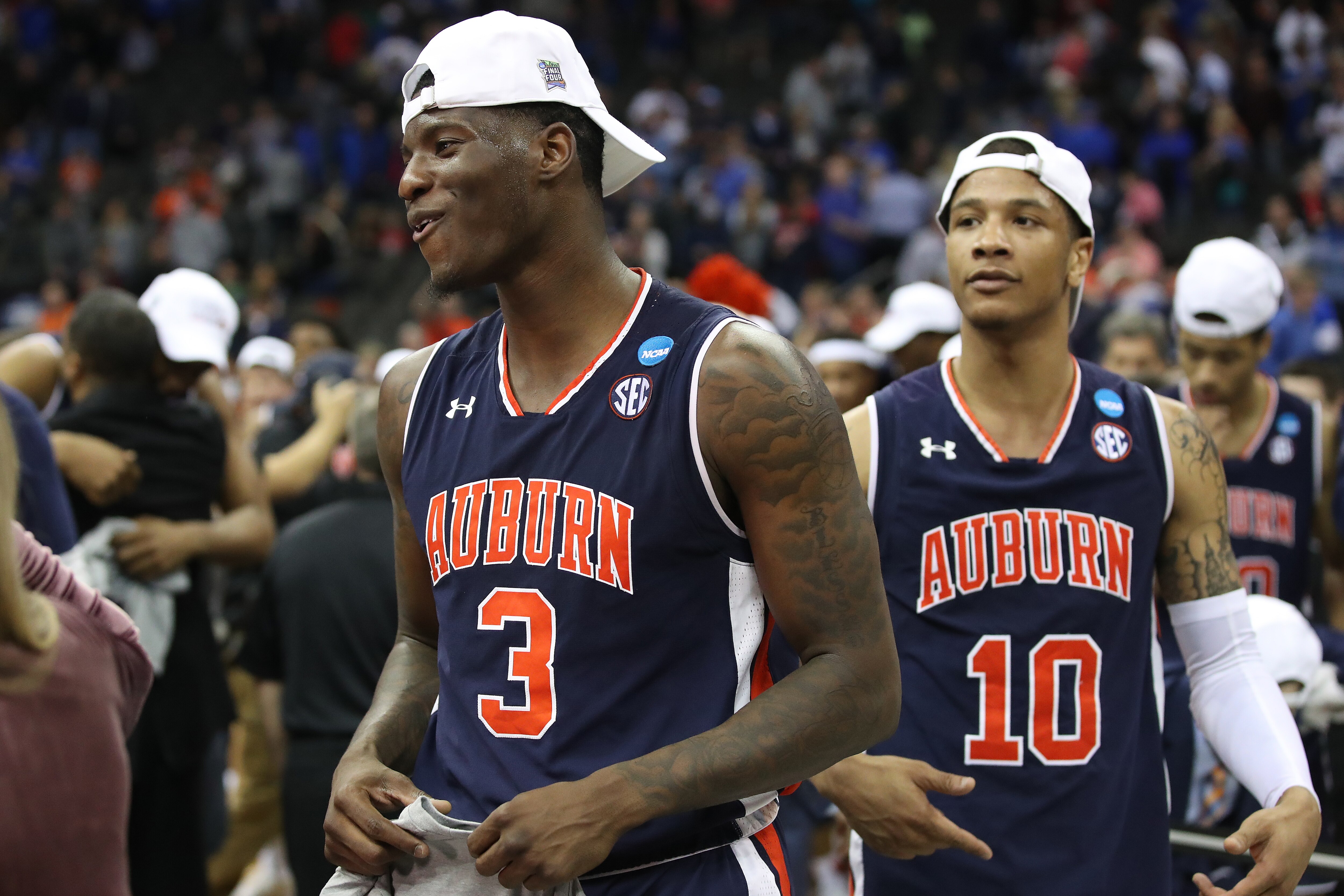 KANSAS CITY, MISSOURI - MARCH 31: Danjel Purifoy #3 and Samir Doughty #10 of the Auburn Tigers celebrate after their 77-71 win over the Kentucky Wildcats in the 2019 NCAA Basketball Tournament Midwest Regional at Sprint Center on March 31, 2019 in Kansas City, Missouri. (Photo by Christian Petersen/Getty Images)