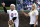 Retired professional wrestler Ric Flair, left, and his daughter Miss Charlotte, the current WWE champion stand on the field before throwing out a ceremonial first pitch before a baseball game between the Atlanta Braves and the Chicago Cubs Sunday, May 1, 2016, in Chicago. (AP Photo/Nam Y. Huh)
