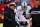 Oakland Raiders head coach Jon Gruden talks to quarterback Derek Carr (4) before an NFL football game against the Kansas City Chiefs in Kansas City, Mo., Sunday, Dec. 30, 2018. (AP Photo/Charlie Riedel)