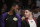 Los Angeles Lakers' LeBron James, left, talks to Lonzo Ball on the bench during the second half of an NBA basketball game against the Washington Wizards, Tuesday, March 26, 2019, in Los Angeles. The Lakers won 124-106. (AP Photo/Jae C. Hong)
