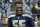 Seattle Seahawks defensive end Frank Clark stands on the field during warmups before an NFL football game against the Washington Redskins, Sunday, Nov. 5, 2017, in Seattle. (AP Photo/Elaine Thompson)