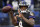 Baltimore Ravens quarterback Lamar Jackson warms up before an NFL football game against the Cleveland Browns, Sunday, Dec. 30, 2018, in Baltimore. (AP Photo/Nick Wass)